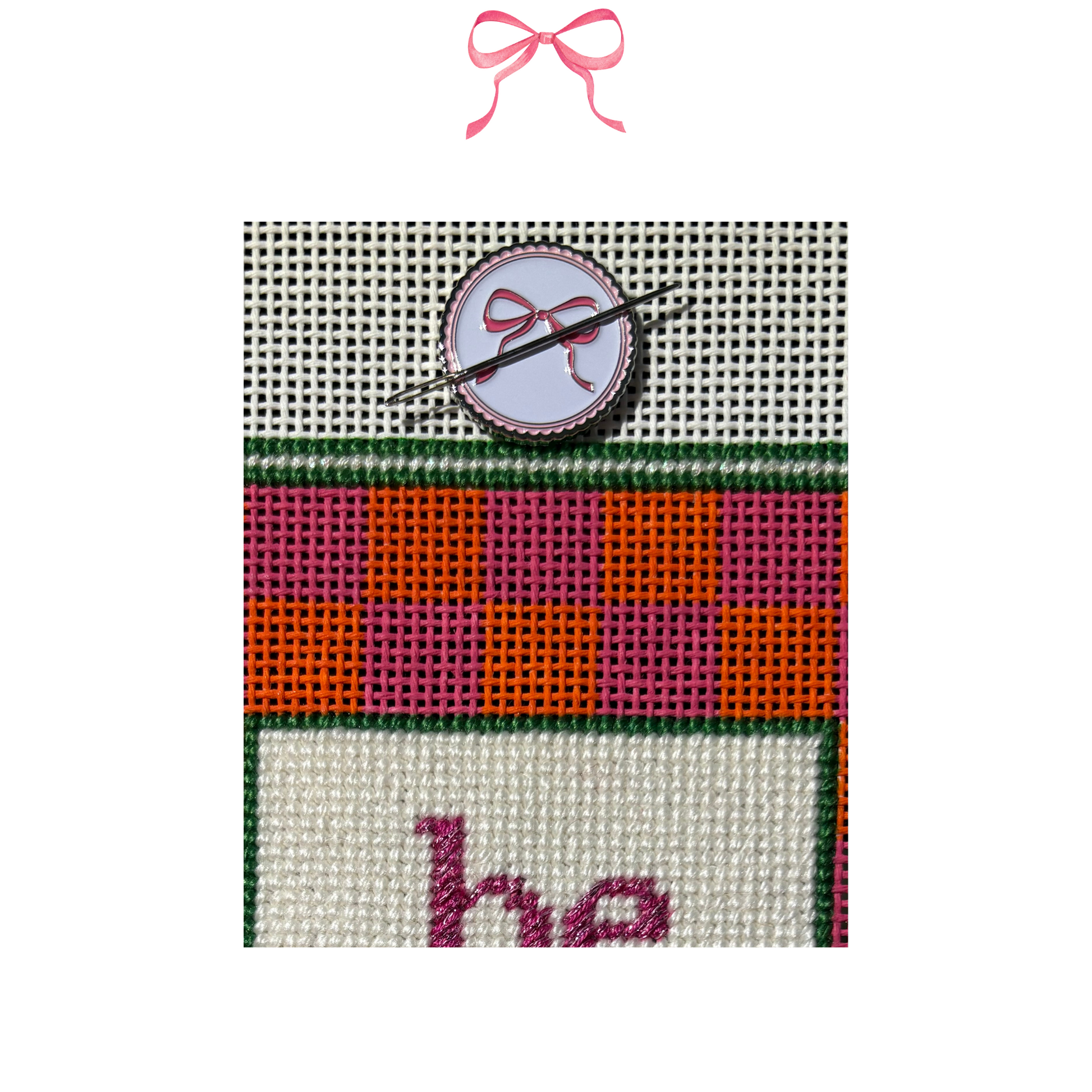 Needlepoint canvas with pink bow metal needle minder